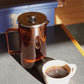 Freshly brewed coffee poured from a French Press Coffee Maker into a ceramic mug