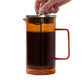 Modern glass French press coffee maker with ergonomic handle and stainless steel filter