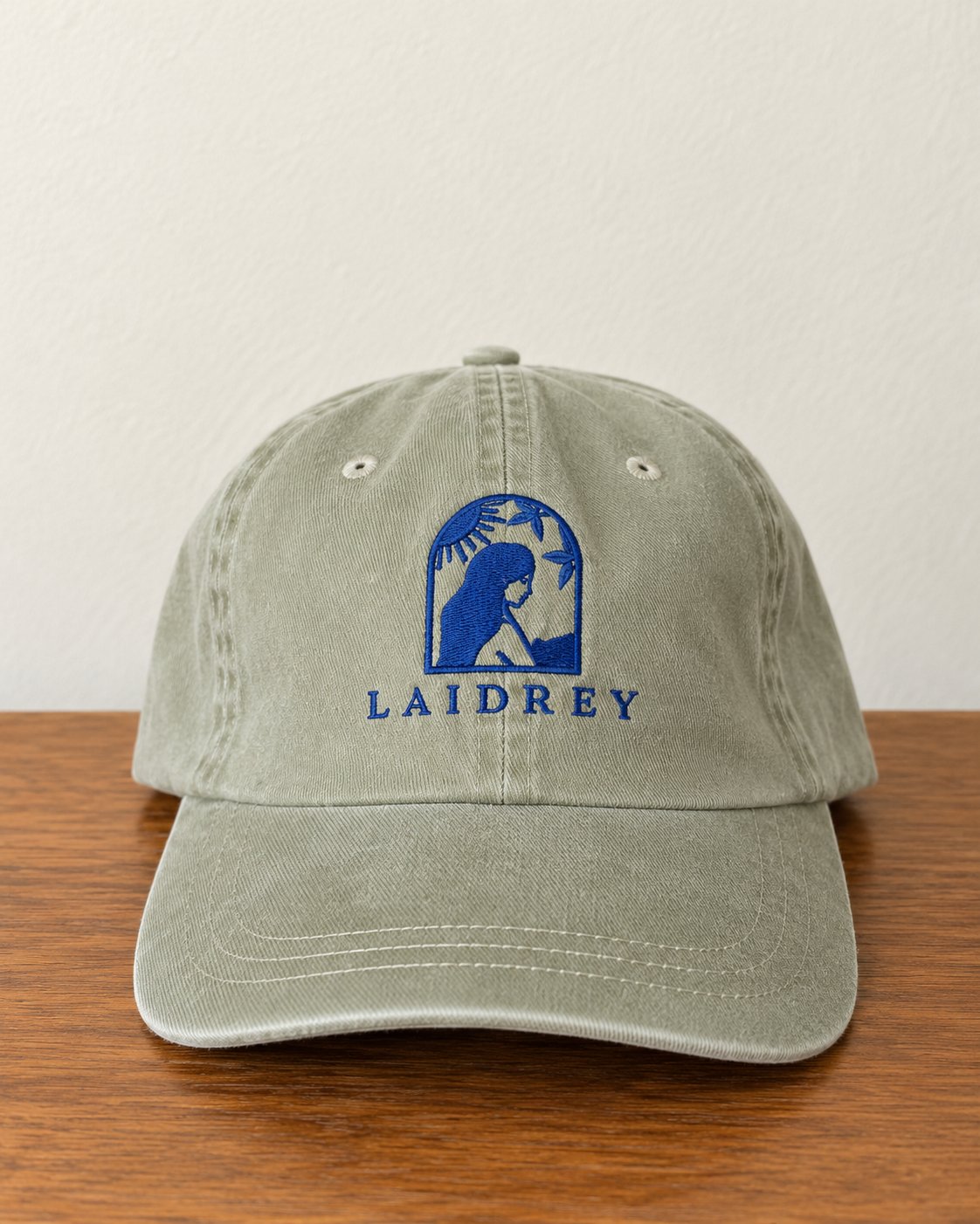 Laidrey khaki baseball cap in pigment-dyed cotton twill with a blue embroidered logo, front view