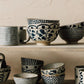 Posy Element mugs and bowls with bluebell floral pattern displayed on a shelf