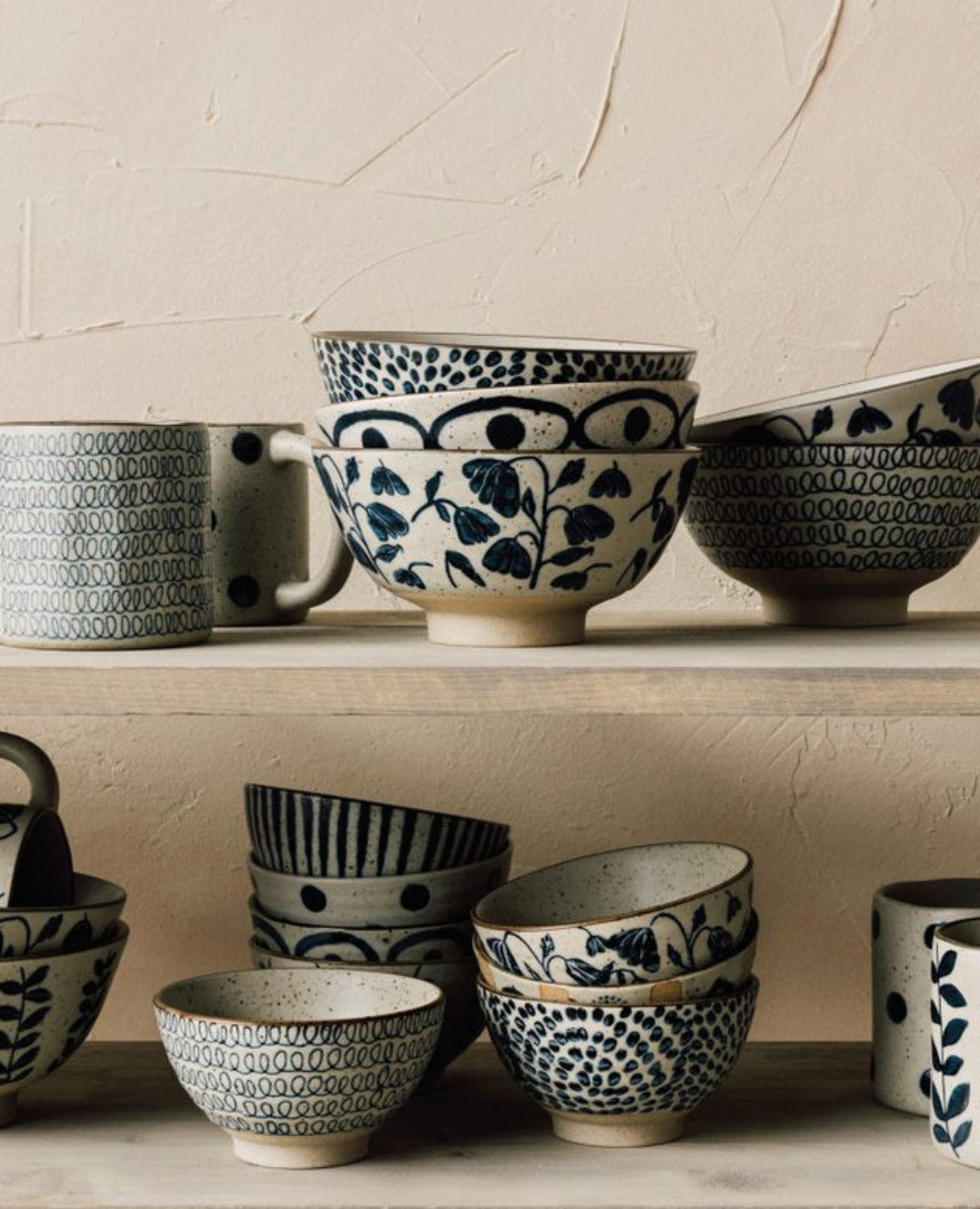 Posy Element mugs and bowls with bluebell floral pattern displayed on a shelf