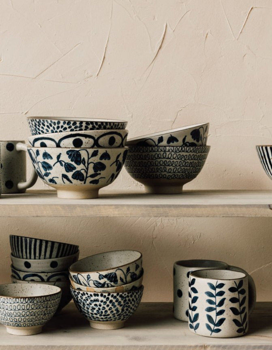 Posy Element mugs and bowls with bluebell floral pattern displayed on a shelf