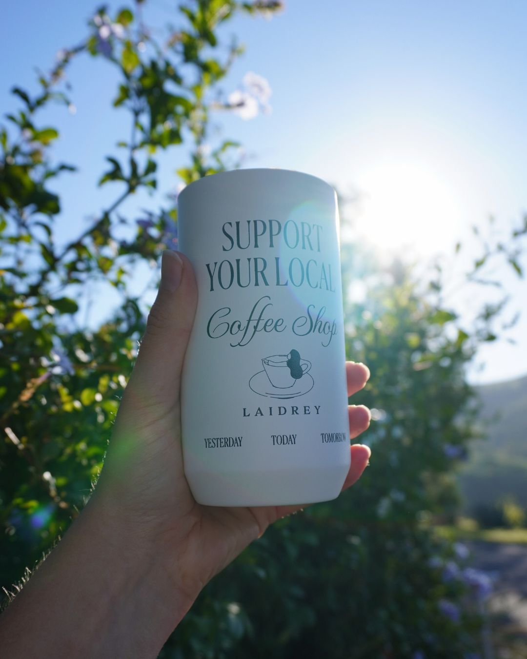 Vacuum insulated coffee tumbler filled with fresh hot coffee